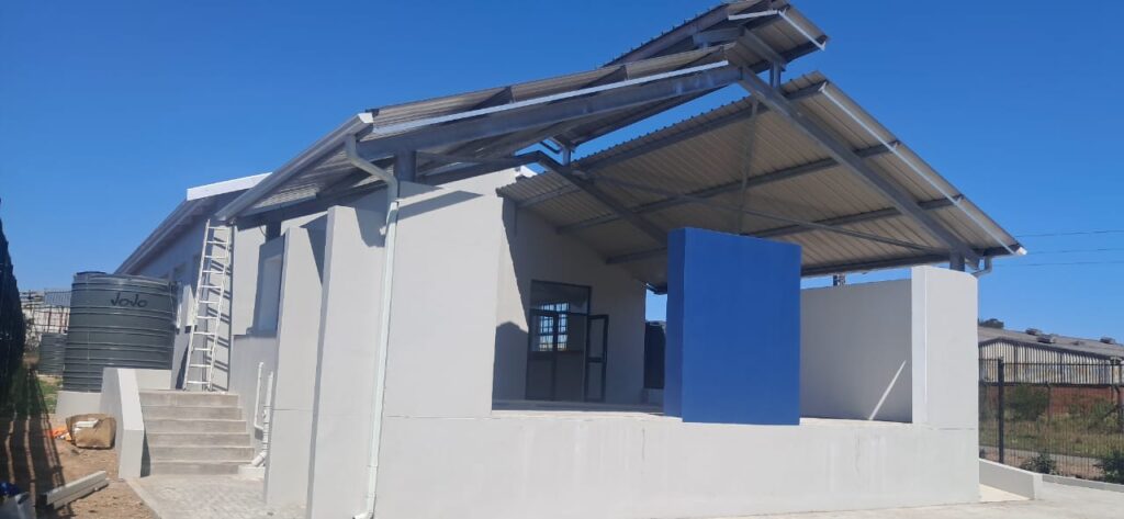 Building exterior featuring steel roof and blue finishes